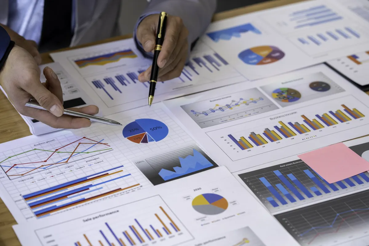 business team analyzing business data charts