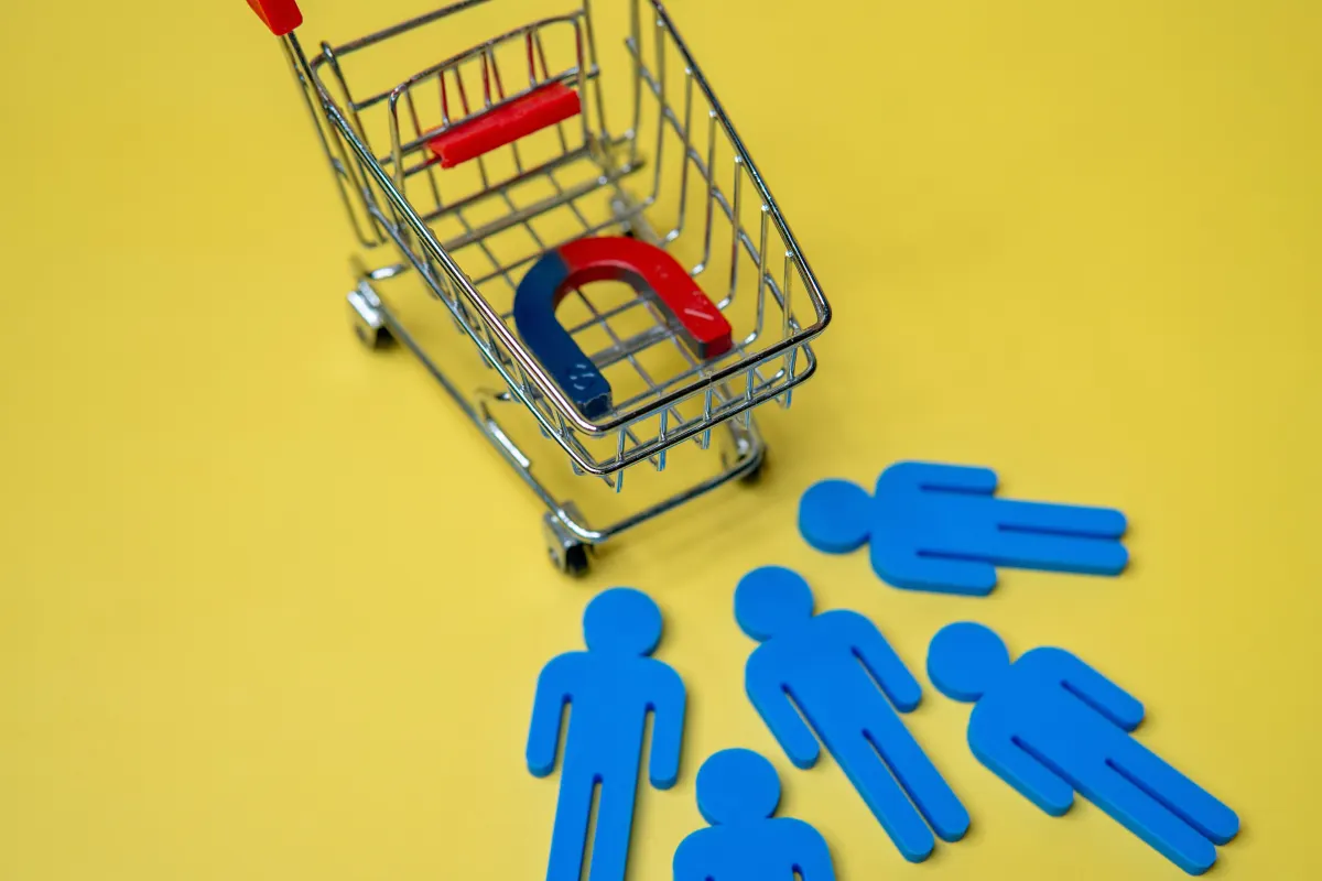 magnet in a shopping cart attracting customers.